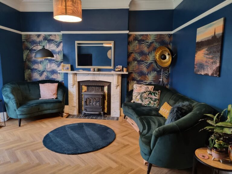 professional housekeeper dusting living room